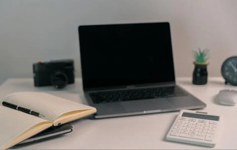 Remote work relies on technology, with employees using laptops and computer.. Stock Photos