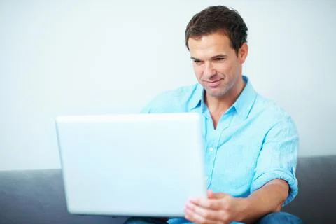 Remote work, review or man on sofa with laptop, proofreading or novel editi.. Stock Photos
