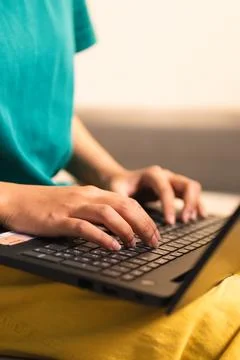 Remote work revolution a person typing laptop at home daily life indoor clo.. 库存照片