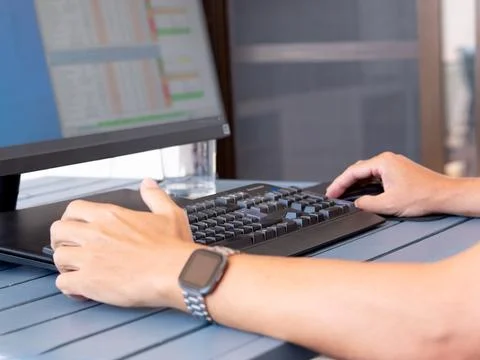 Remote work setup with casual attire and modern desk accessories Stock Photos