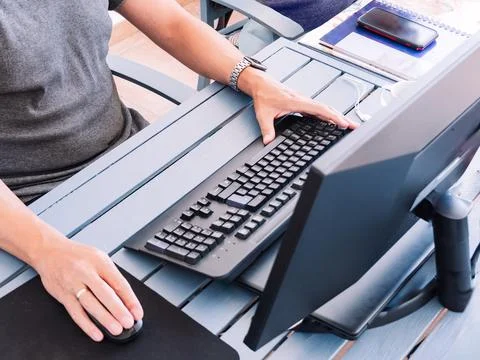 Remote work setup with casual attire and modern desk accessories Stock Photos