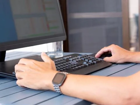 Remote work setup with casual attire and modern desk accessories Stock Photos