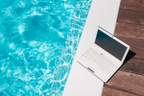 Remote Work by the Swimming Pool with Laptop Mockup Stock Photos