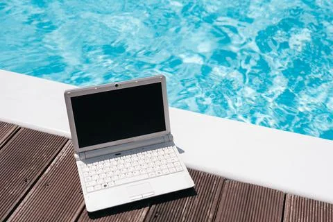 Remote Work by the Swimming Pool with Laptop Mockup Stock Photos