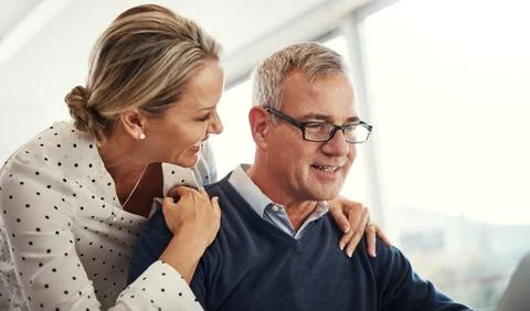 Remote work, tech and couple with support in home for chapter editing, draf.. Stock Photos