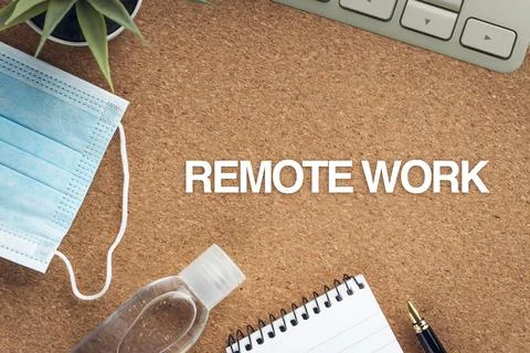 REMOTE WORK text with face mask, hand sanitizer , keyboard and  decorative pl Stock Photos