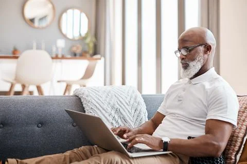 Remote work, typing and man with laptop in lounge, email marketing and rese.. Stock Photos