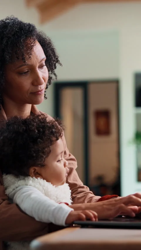 Remote work, typing and mom with baby on laptop for copywriting, online project Stock Footage 335849153