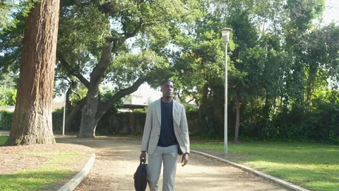 Remote Worker Begins His Day with a Call and a Parkside Commute Stock Footage 308788089