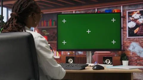 Remote worker doing tasks on chroma key computer, typing information Foto stock