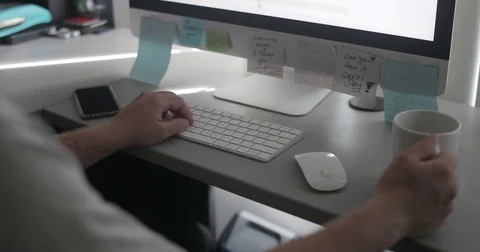 Remote worker drinks tea in home office Stock Footage 78037090