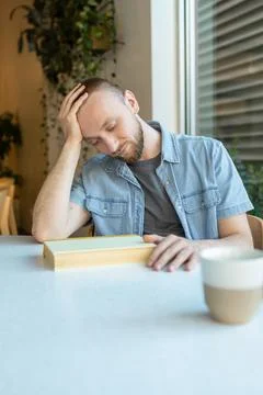 Remote worker feeling frustrated while studying online in a cafe during the.. Fotos Stock