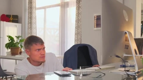 Remote worker frustrated with technical issue, trying to fix monitor. Stock Footage 294295047