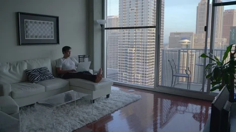 Remote Worker at HIgh Rise Apartment Stock Footage 114935236