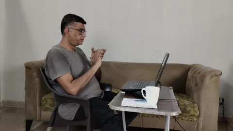 Remote Worker Prepares for Session After Tea Break Stock Footage 313046346