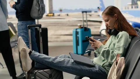 Remote worker react to postponed flights and shutdown conditions Stock Photos