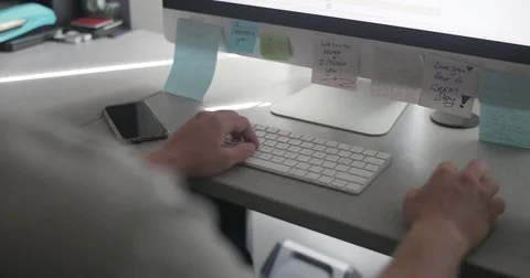 Remote worker uses keyboard in home office Stock Footage 78037097