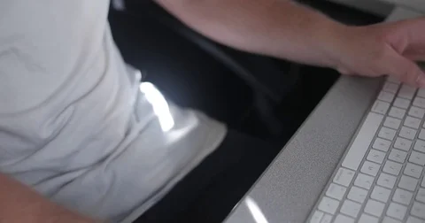 Remote worker uses keyboard in home office Video stock 78037136