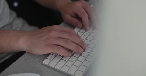 Remote worker uses keyboard in home office Stock Footage 78037137