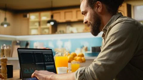 Remote worker using laptop and digital tools to analyze research information 스톡 사진