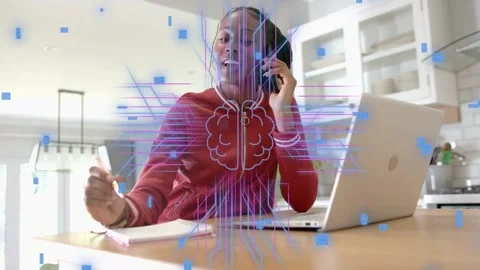 Remote worker using phone and laptop in kitchen, call initiating tech overlay Stock Footage 333192886
