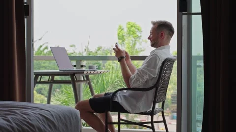 Remote Worker Using Smartphone During Flexible Hotel Work Routine Stock Footage 335318265