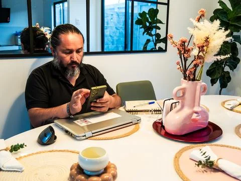 Remote Worker Using Smartphone During Home Office 스톡 사진