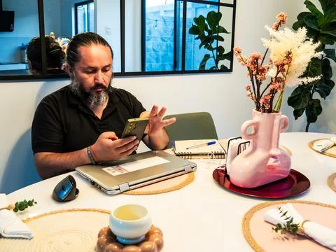 Remote Worker Using Smartphone During Home Office 写真素材