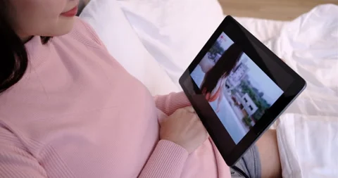 Remotely connection user interface: Young asian woman watching video Видео 132342334