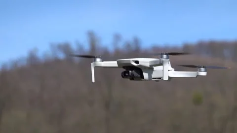 Remotely controlled drone with camera system in full operation Stock Footage 270536867
