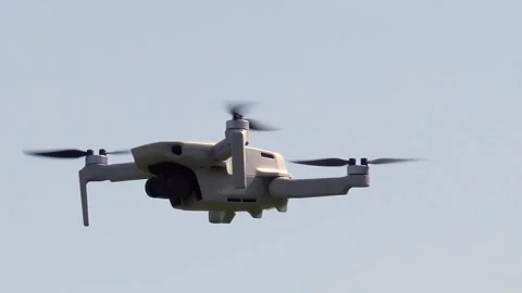 Remotely controlled drone with camera system in full operation Stock Footage 270538986