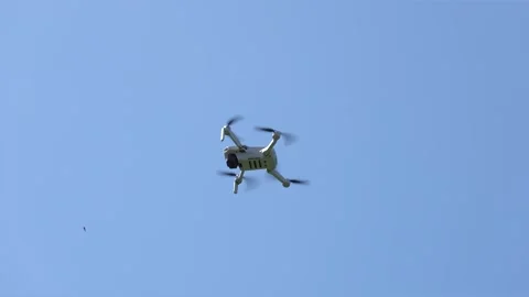 Remotely controlled drone with camera system in full operation Stock Footage 272591658