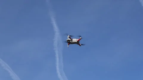 Remotely controlled drone with camera system in full operation Stock Footage 291975424