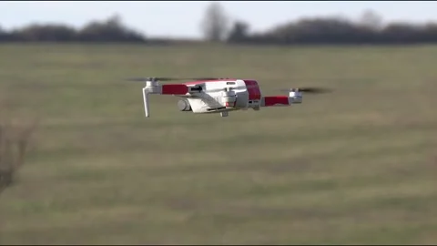 Remotely controlled drone with camera system in full operation Stock Footage 291980228