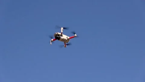 Remotely controlled drone with camera system in full operation Stock Footage 304739162