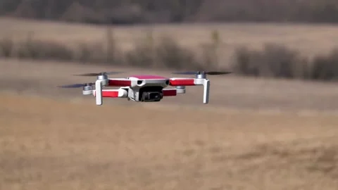 Remotely controlled drone with camera system in full operation Stock Footage 304739163