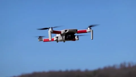 Remotely controlled drone with camera system in full operation Stock Footage 304739358