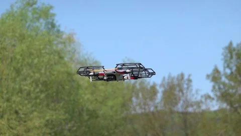 Remotely controlled drone with camera system in full operation Stock Footage 307535236