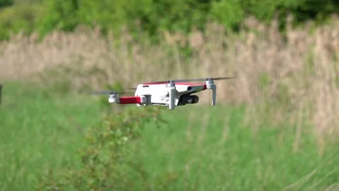 Remotely controlled drone with camera system in full operation Stock Footage 308253843