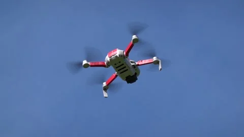 Remotely controlled drone with camera system in full operation Stock Footage 308254090