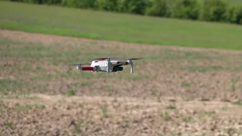 Remotely controlled drone with camera system in full operation Stock Footage 308254091