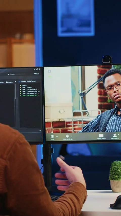 Remotely working software developer talking with manager during online videocall Stock Footage 264513327