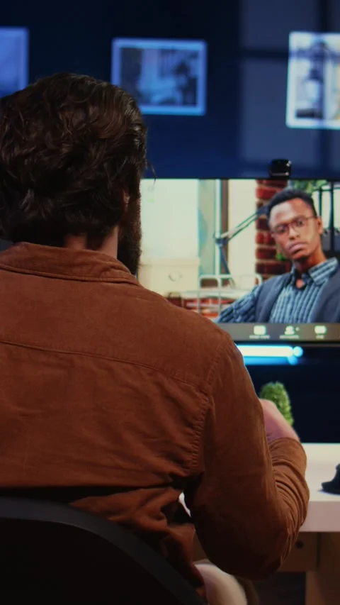 Remotely working software developer talking with manager during online videocall Stock Footage 264514336