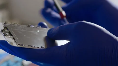 Removal of protective protection from a microchip. Stock Footage 166920225