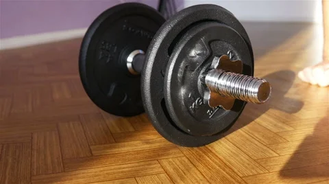 Removal Weights from a Dumbbell Stock Footage 55289336