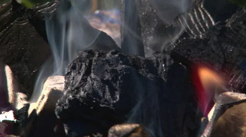 Remove coals burning in handmade brazier, close up shoot Stock Footage 63211174