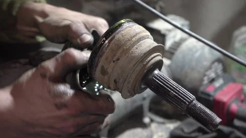 Remove the CV boot from the axle shaft Video stock 308937833