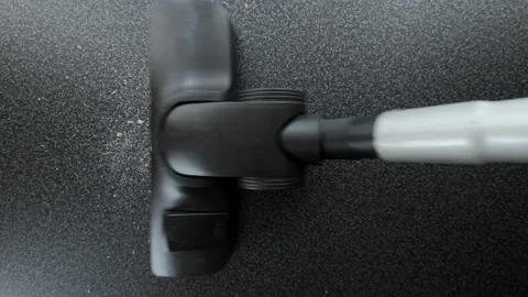 Remove dust from the surface with a vacuum cleaner Stock Footage 121688342