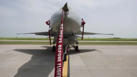 Remove before flight ribbon safety on a fighter jet 스톡 동영상 274144646