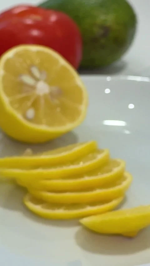Remove the lemon seeds food. Lemon slicing. Female hands cutting fresh lemons Stock Footage 327563431